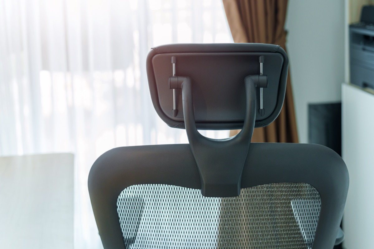 An ergonomic mesh task chair at a home-office desk