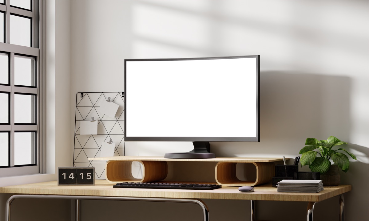 A dual-monitor desk setup showing code